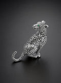 The Dietrich silver leopard brooch with emerald crystal eyes, an Old Hollywood style lapel brooch