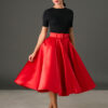 Woman wearing The Grace red satin full circle midi skirt with matching belt and pockets