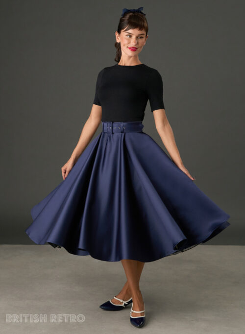 Woman wearing The Grace navy satin full circle midi skirt with matching belt and pockets