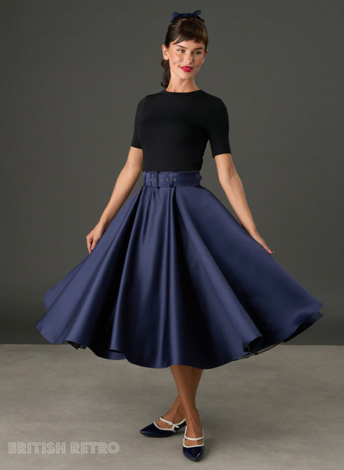 Woman wearing The Grace navy satin full circle midi skirt with matching belt and pockets
