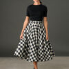 Woman wearing The Eloise black and white gingham full circle midi skirt with matching belt