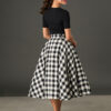 Woman wearing The Eloise black and white gingham full circle midi skirt with matching belt